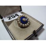 A Victorian Pearl Set Brooch, of circular design highlighted in blue enamel.