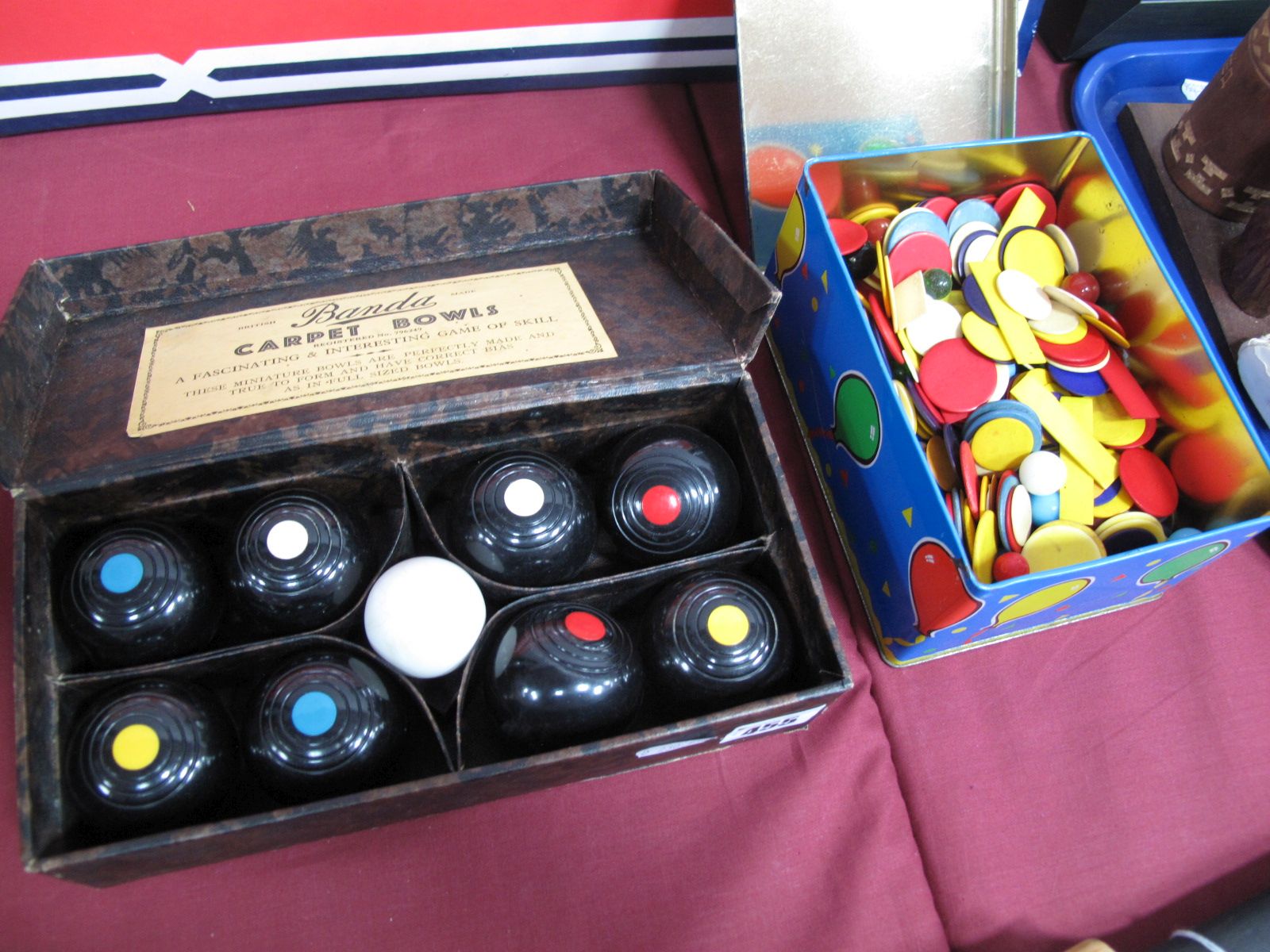 A Mid XX Century Set of Carpet Bowls, by Banda, boxed. Plus, a large quantity of coloured games