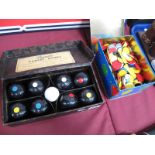 A Mid XX Century Set of Carpet Bowls, by Banda, boxed. Plus, a large quantity of coloured games