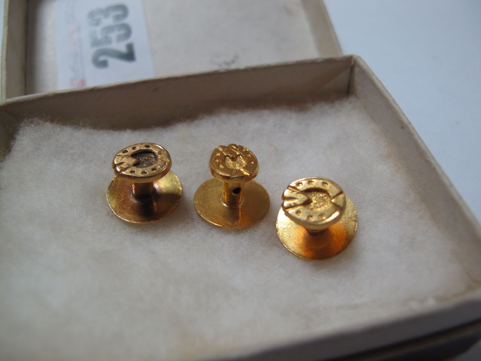 A Set of Three Gent's Dress Studs, each as a horseshoe, stamped "22c".