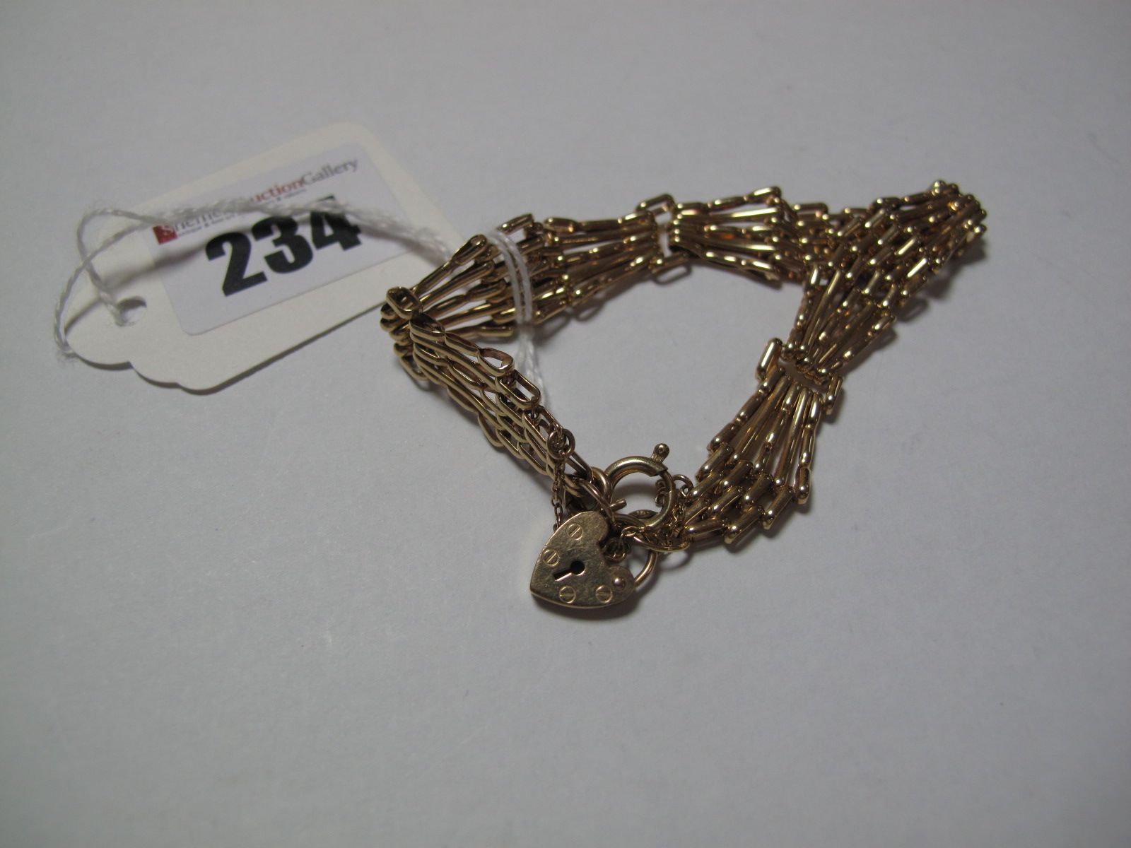 A Fancy Link Bracelet, to 9ct gold heart shape locket clasp.