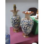 George Tinworth, a pair of Doulton Lambeth Stoneware Vases, each with blue scroll and white bead