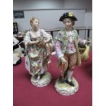 A Pair of Late XIX Century Continental Porcelain Figures of Flower Basket Carrying Beau and belle,