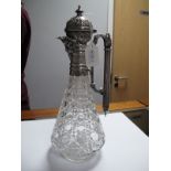 A Plated Mounted Cut Glass Claret Jug, of tapering form, with mask spout, domed hinged lid and