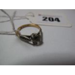 A Single Stone Ring, claw set between inset shoulders, stamped "18ct & SIL".