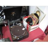 H.M.V. Portable Gramophone, in black leatherette covering; together with winder, needles and 78