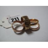 A 9ct Gold Patterned Wedding Band, together with another 9ct gold band and two others. (4)