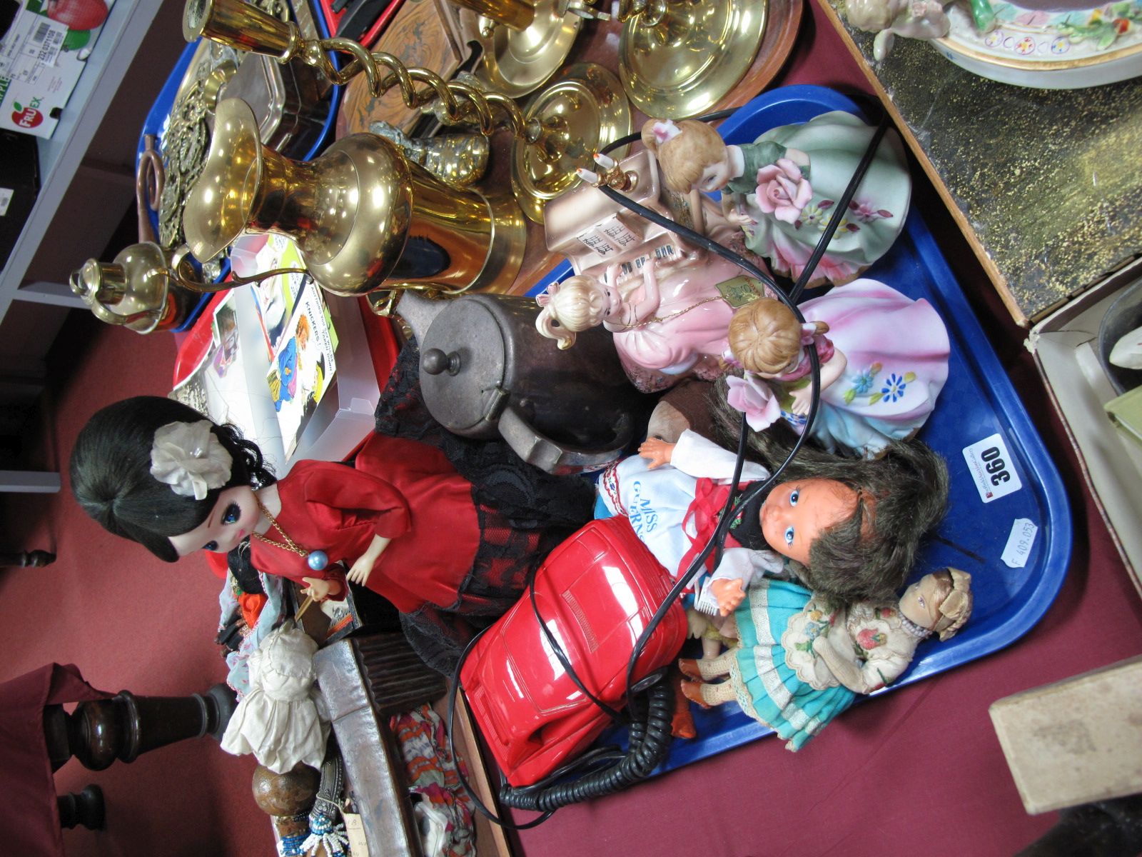 Betacom Telephone, as a red sports car, dolls, musical figurines, hot water jug. One tray