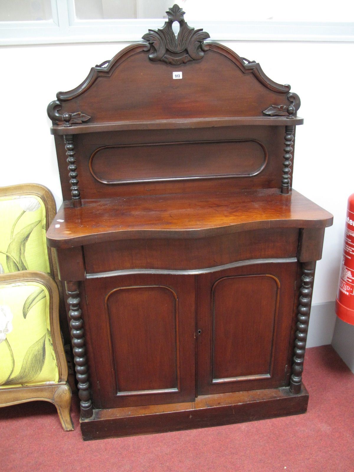 A Victorian Mahogany Chiffonier, arched gallery back with foliate carving support, twin