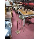 A Distressed Metal Six Branch Floor Standing Candelabrum, together with matching glass top table/