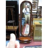 A Reproduction Victorian Style Mahogany Cheval Mirror, on ring turned supports and oval base