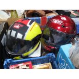 A Shoei and an Aprillia Motorcycle Helmet. (2)