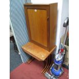 A Circa 1970's teak Nest of Three Tables, plain tops on shaped ends, and a teak narrow cabinet