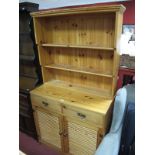 A Modern Pine Kitchen Dresser, three shelves over two frieze drawers and twin slatted cupboard