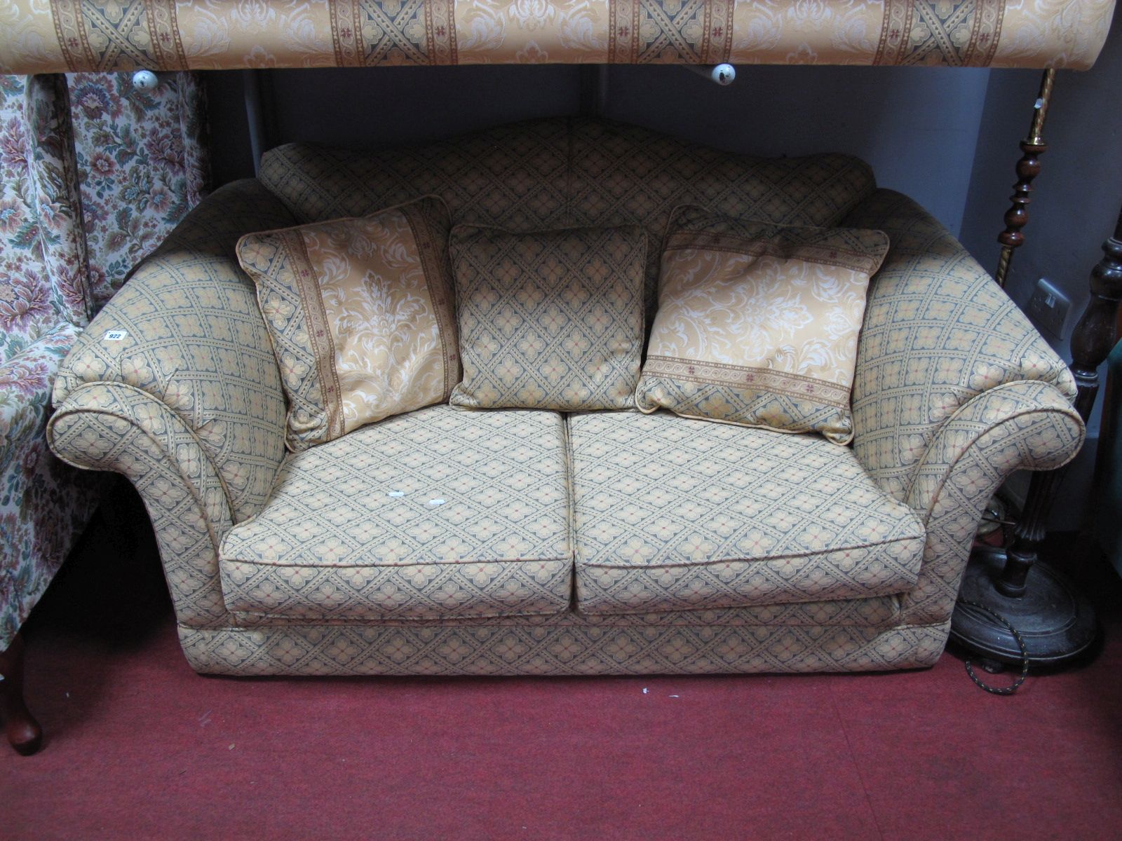 A Lincoln House Two Seater Settee, in crosshatch flowerhead upholstery.