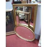 A Gilt Framed Bevelled Rectangular Wall Mirror, an oval wall mirror and a further rectangular