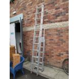 A Set of ELIMA Aluminium 22 Rung Extending Ladders, and a set of household steps. (2)
