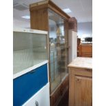 A Large Pine Display Cabinet, with twin glazed sliding doors and interior shelving.