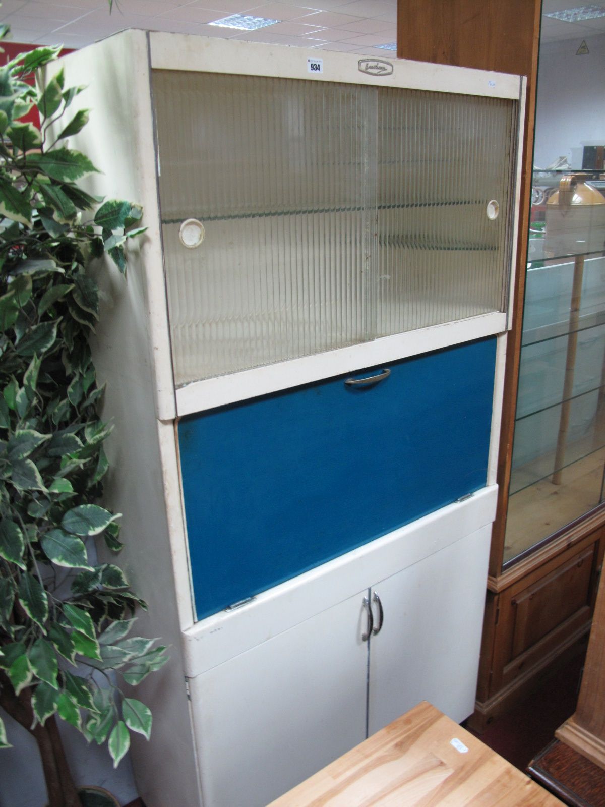 A Vintage Eastham Kitchen Unit, with sliding frosted doors over fall front and cupboard with