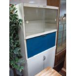 A Vintage Eastham Kitchen Unit, with sliding frosted doors over fall front and cupboard with