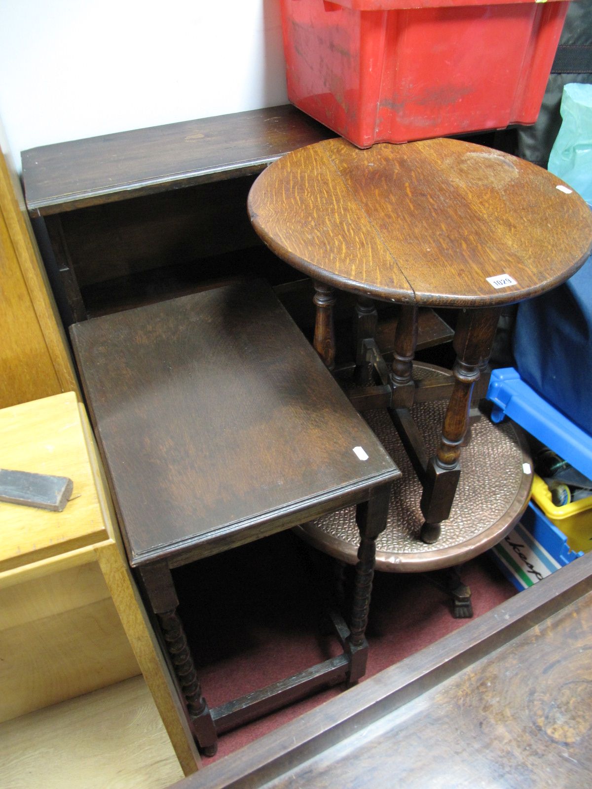 An Oak Circular Topped Folding Occasional Table, a further oak occasional table, a hammered copper