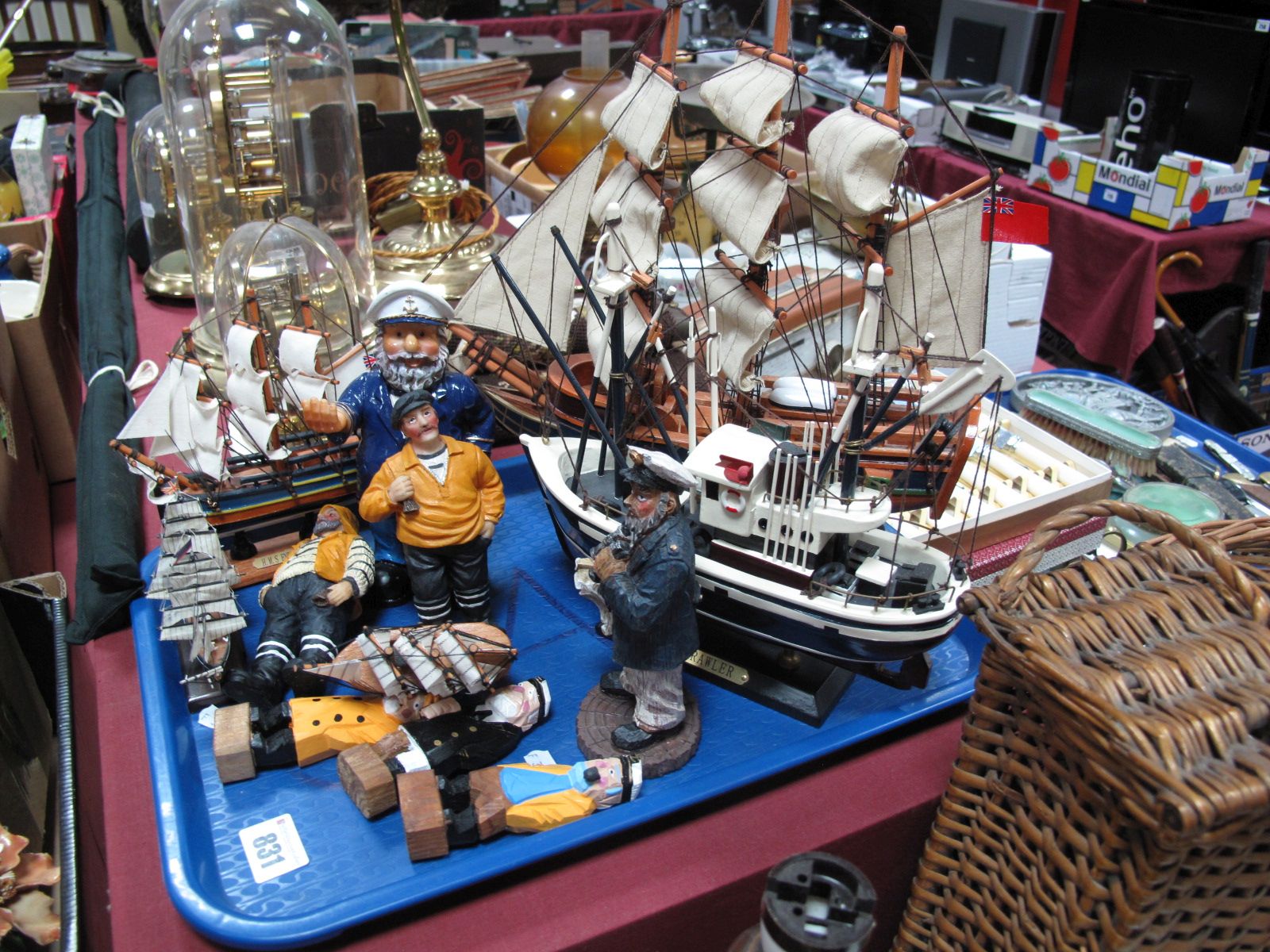 Five Model Sailing Ships / Trawlers, mounted on stands, and seven resin and carved wooden sailors.
