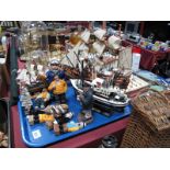 Five Model Sailing Ships / Trawlers, mounted on stands, and seven resin and carved wooden sailors.