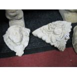 Two Poured Concrete Garden Wall Pocket Planters, both with moulded cherubic faces.