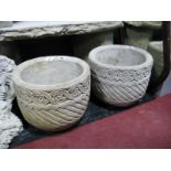 A Pair of Concrete Planters, having foliate banding of circular form.