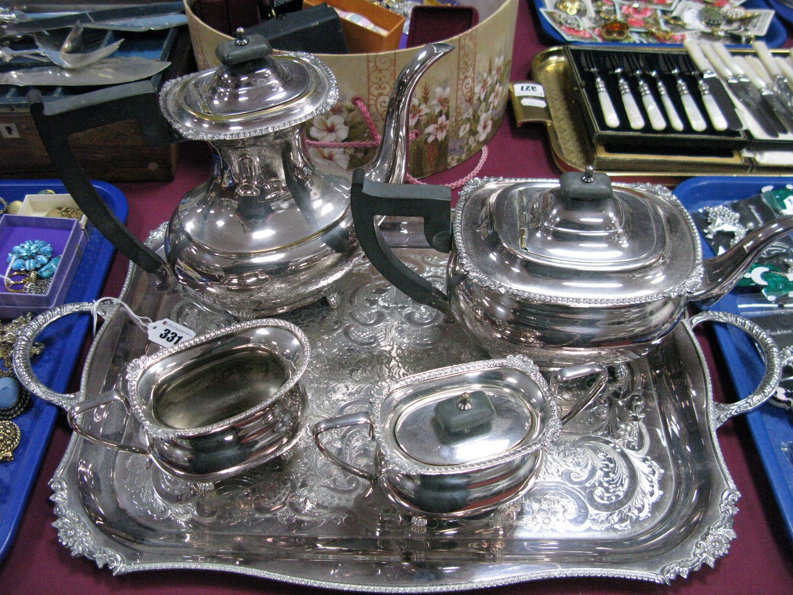 A Plated Four Piece Tea Set, each of oval form, a rectangular twin handled plated tray.