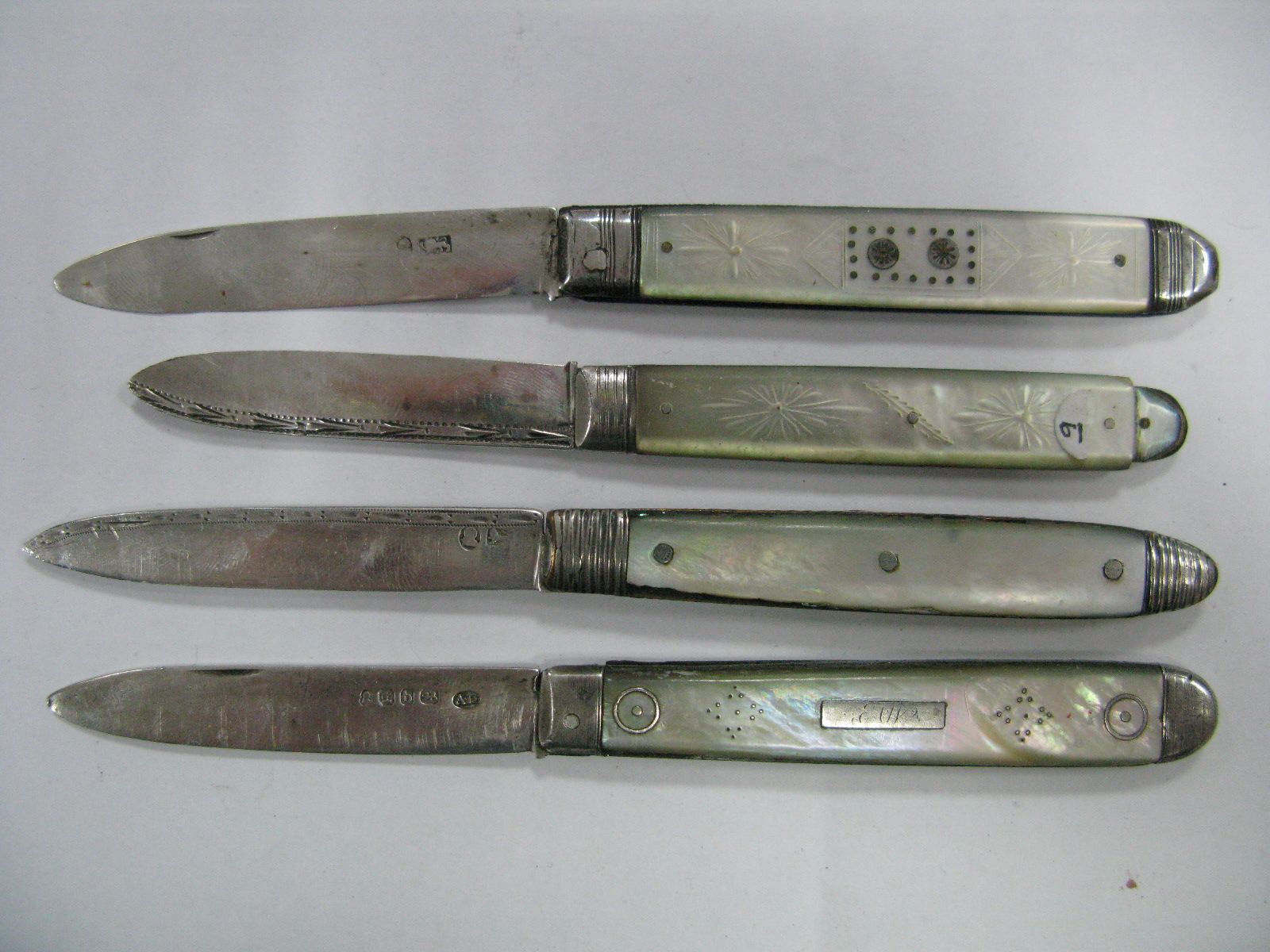 Four Hallmarked Silver and Mother of Pearl Folding Fruit Knives, (pre-Victorian), three with