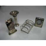 A Hallmarked Silver Toast Rack, a Dunhill table lighter, miniature clock and a small trumpet