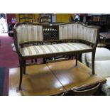 An Edwardian Inlaid Two Seater Salon Seat, shaped top rail, upholstered back and seat, on splayed