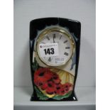 A Moorcroft Pottery Clock, decorated with the Forever England design by Vicky Lovatt, impressed