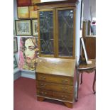 An Edwardian Bureau Bookcase, having moulded cornice over twin glazed astragal glazed doors, fall