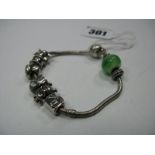 A Pandora Style Sliding Charm Bracelet, stamped "925".