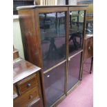 A XIX Century Mahogany Bookcase, having twin glazed cupboard doors and adjustable shelving, on