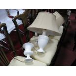 A Pair of Cream Pottery Urn Shaped Table Lamps, with gold fabric shades; together with a Beswick