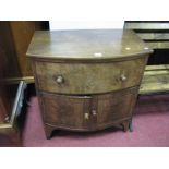 Early XIX Century Bow Fronted Cabinet, with a single drawer over two cupboard doors, on bracket