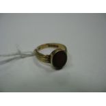 An 18ct Gold Hardstone Inset Ring, oval collet set.