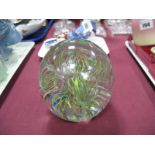 A Large Spherical Paperweight, with random open twist canes within clear glass.