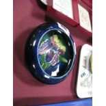 Moorcroft Pottery Dish, in Orchid pattern on a deep blue ground, having inverted rim, 11cms