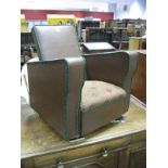 A Circa 1930's Child's Armchair, in brown leatherette and green piping.