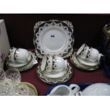 A Tuscan China Tea Service, with cobalt blue and gilt swag borders on a white ground:- Nineteen