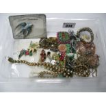 Costume Brooches, beads, etc:- One Box