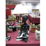 A Mid XX Century Painted Plaster table Lamp Base, formed with a seated female, made in black,