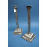 A Pair of Plated Candlesticks, of Corinthian column design, with removable nozzles, 37cms high. (2)