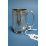 A Victorian Hallmarked Silver Mug, GMJ, London 1892, with foliate decoration and elongated loop