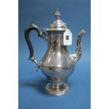 A Hallmarked Silver Coffee Pot, (makers mark rubbed) London 1904, of plain baluster form, the hinged