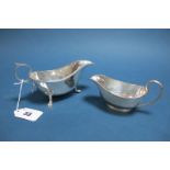 A Hallmarked Silver Sauce Boat, CB&S, Sheffield 1923, with gadrooned edge, raised on three paw feet;